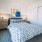 Comfortable bedroom with natural light at Eleanor Apartments in Seattle