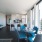 Open kitchen with island and living room at Eleanor Apartments Seattle