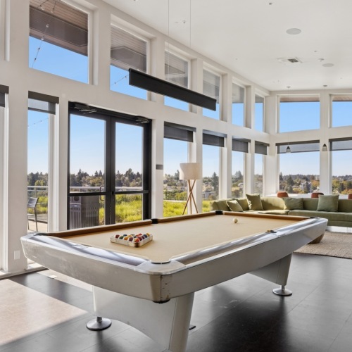 Community lounge with pool table at Eleanor Apartments in Seattle