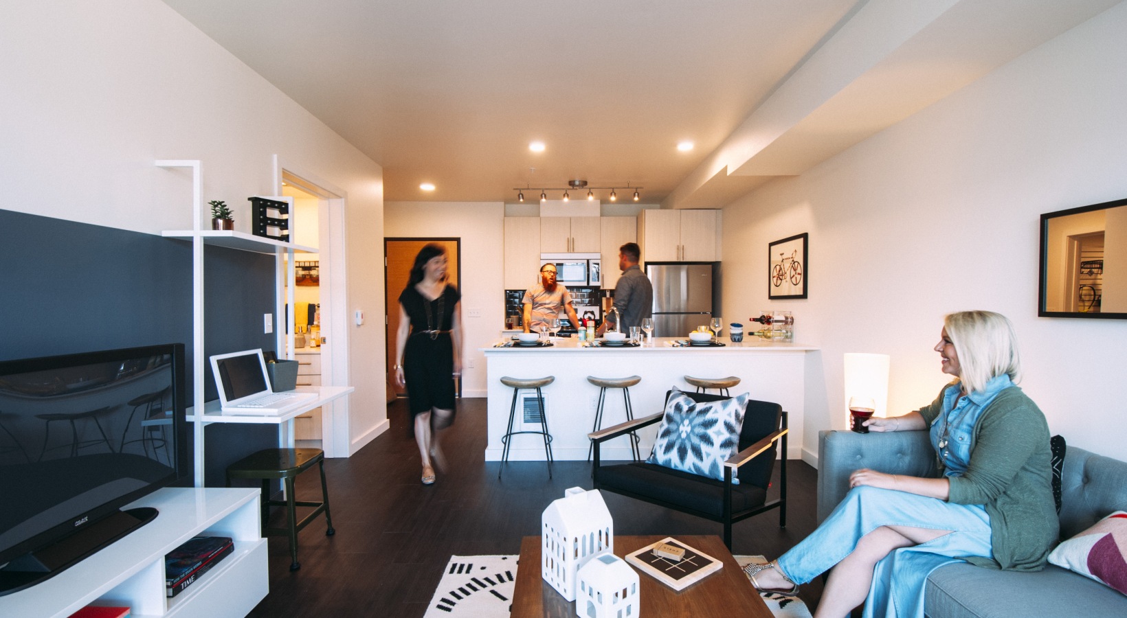 Seamless Flow Between Cooking And Gathering Spaces Spacious open-concept kitchen and living area at Eleanor Apartments in Seattle