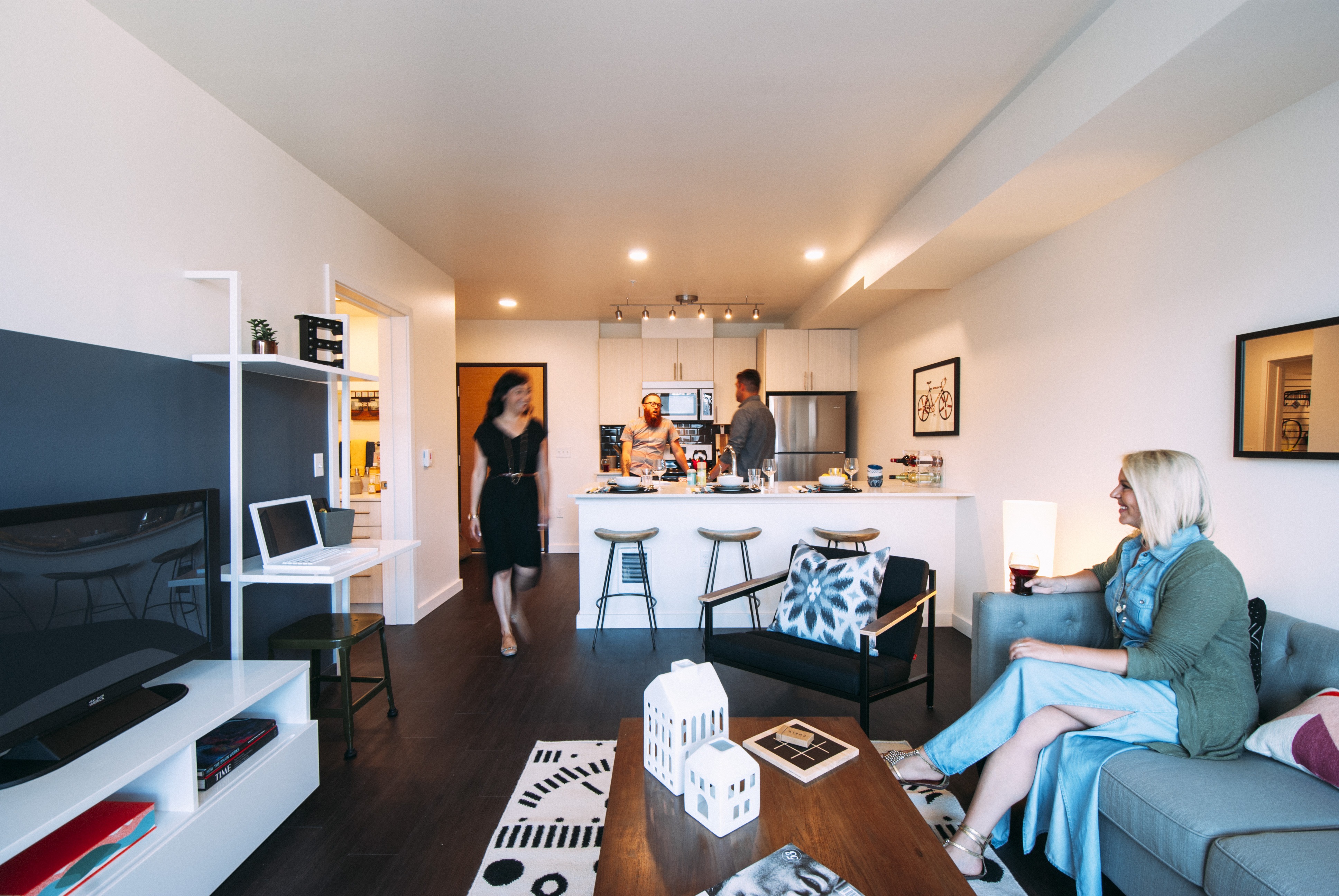 Seamless Flow Between Cooking And Gathering Spaces Spacious open-concept kitchen and living area at Eleanor Apartments in Seattle